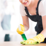 cleaner wiping down a table